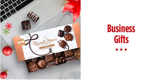 box chocolate candy next to a laptop